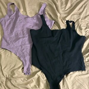 Fashion Nova Women's Thong Bodysuits in Black and Purple